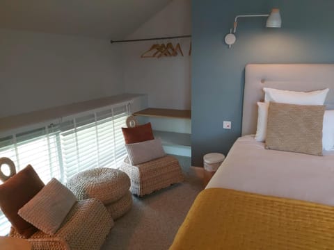 Bed, Living room, Seating area, Bedroom