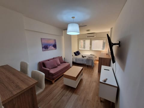 Bed, TV and multimedia, Living room, Photo of the whole room, Seating area, Bedroom
