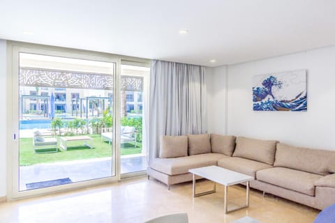 Living room, Seating area, Garden view, Pool view