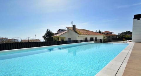 CANELAS PREMIUM NUEVOS con PISCINA, AMPLIAS TERRAZAS Y GARAJE Apartment in Portonovo