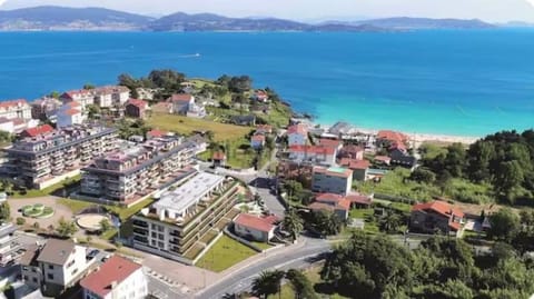 CANELAS PREMIUM NUEVOS con PISCINA, AMPLIAS TERRAZAS Y GARAJE Apartment in Portonovo