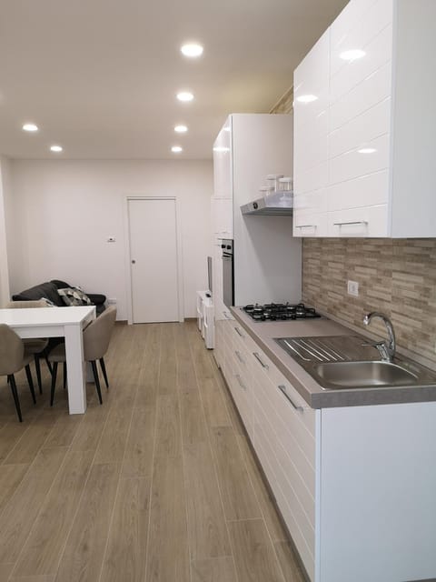 Kitchen or kitchenette, dishwasher, stove