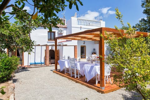 Property building, Patio, Dining area, Garden view