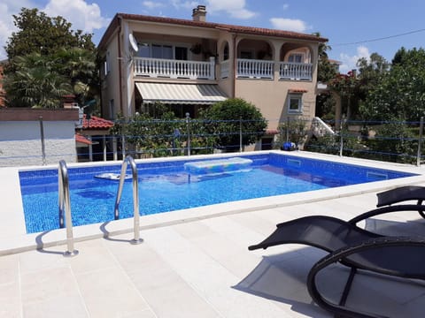 Property building, Pool view, Swimming pool, sunbed