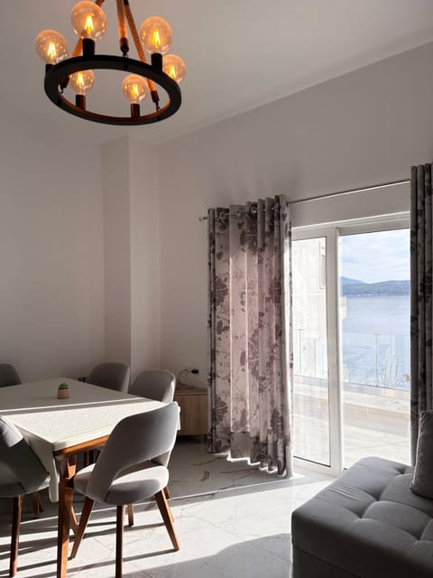 View (from property/room), Living room, Seating area, Dining area, Sea view