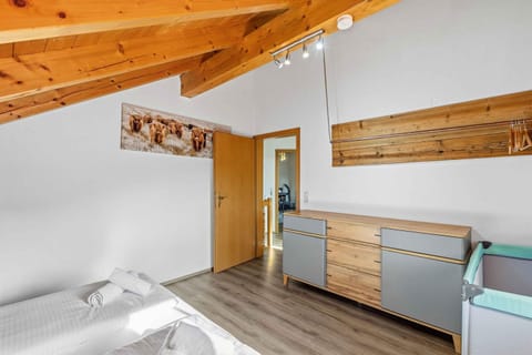 Bed, towels, wardrobe