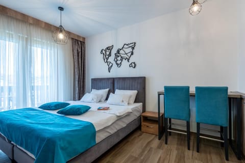 Bed, Kitchen or kitchenette, Living room, Seating area, Bedroom