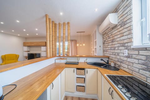 Kitchen or kitchenette, stove, air conditioner