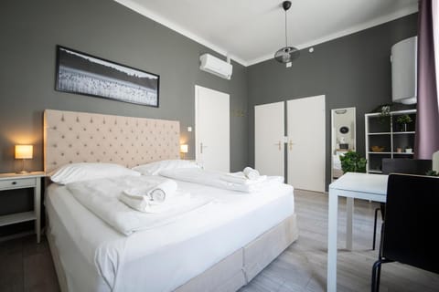 Bed, Photo of the whole room, Bedroom, towels, air conditioner