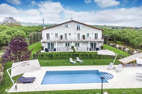 Property building, Patio, Day, Natural landscape, Garden, Garden view, Pool view, Swimming pool, sunbed