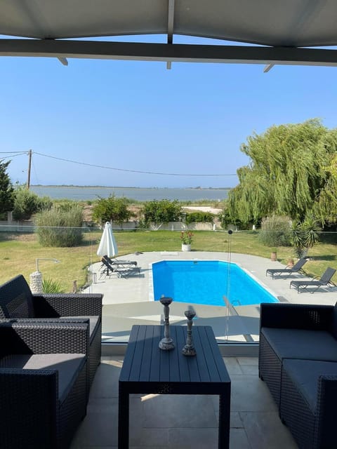 Patio, Day, Natural landscape, Living room, Seating area, Pool view