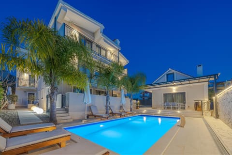 Property building, Patio, Night, Pool view, Swimming pool