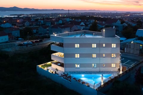 Property building, Bird's eye view, Swimming pool, Sunset