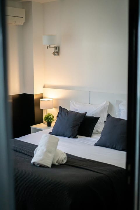 Bed, Photo of the whole room, Bedroom, towels, air conditioner