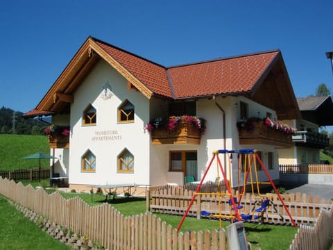 Property building, Facade/entrance, Day, Summer, Children play ground