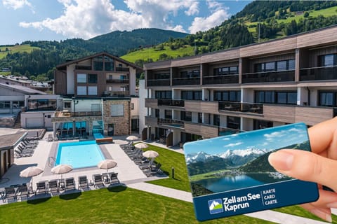 Property building, Property logo or sign, Natural landscape, Mountain view, Pool view, Swimming pool, Certificate/Award, sunbed