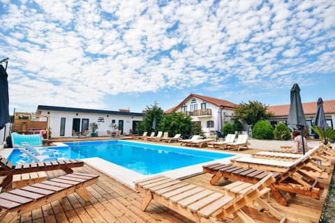 Property building, Pool view, Swimming pool, sunbed