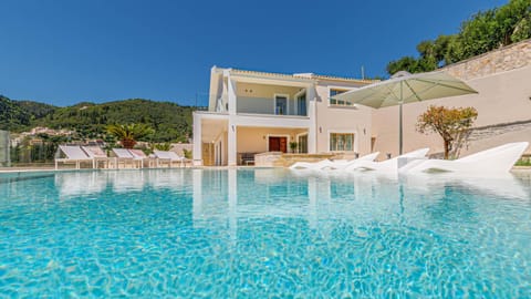 Property building, Patio, Pool view, Swimming pool, sunbed
