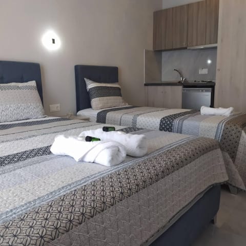 Bed, Photo of the whole room, Bedroom, stove, towels, kitchen