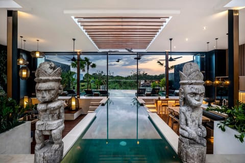 Property building, Living room, Seating area, Pool view, Swimming pool