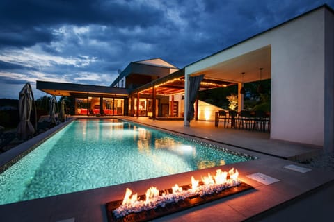 Property building, Night, Seating area, Pool view, Swimming pool, Dinner, flat iron