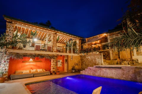 Property building, Patio, Night, Pool view, Swimming pool