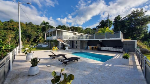 Property building, Patio, Pool view, Swimming pool, sunbed