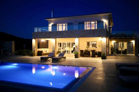 Property building, Patio, Night, Pool view, Swimming pool