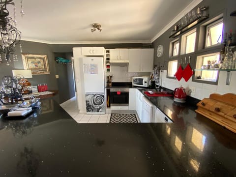 Kitchen or kitchenette, dishwasher, oven, stove