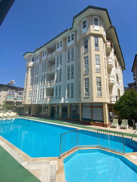 Property building, Day, Pool view, Swimming pool, sunbed