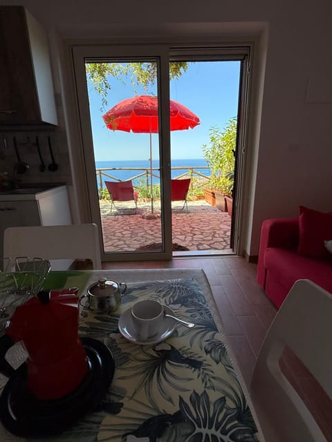 Natural landscape, View (from property/room), Living room, Seating area, Dining area, Sea view