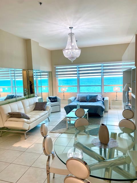 Bed, Living room, Seating area, Sea view