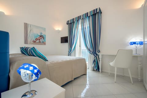 Bed, TV and multimedia, Living room, Seating area, Bedroom