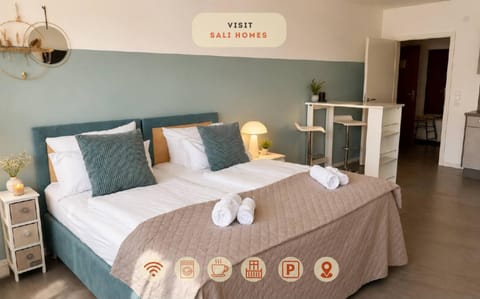 Bed, Photo of the whole room, Bedroom, Text overlay, towels