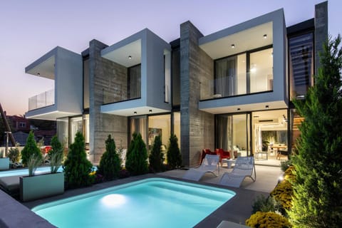 Property building, Patio, Pool view, Swimming pool, sunbed