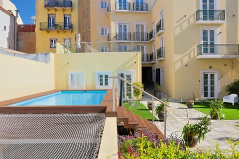 Property building, View (from property/room), Pool view, Swimming pool, sunbed