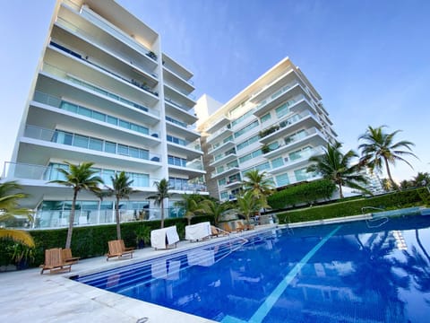 Property building, Beach, Swimming pool, sunbed