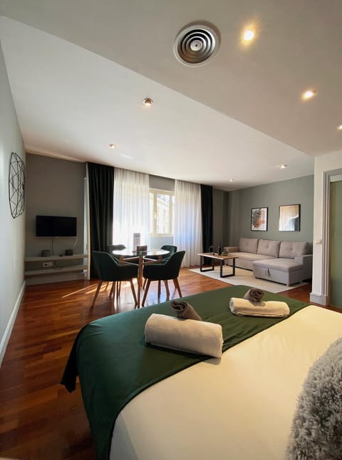Bed, Living room, Seating area, Dining area