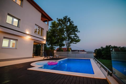 Property building, Night, Pool view, Swimming pool, sunbed