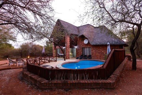 Property building, Garden, View (from property/room), Balcony/Terrace, Seating area, Garden view, Swimming pool