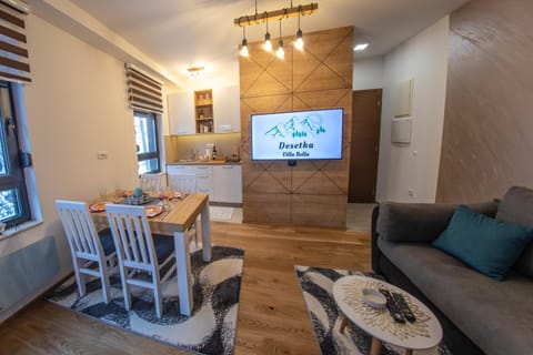 TV and multimedia, Living room, Seating area, Dining area, Text overlay, Text overlay, Parking, furniture, locker