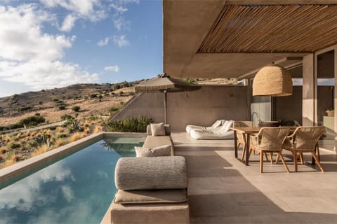Property building, Patio, Day, Natural landscape, View (from property/room), Balcony/Terrace, Living room, Seating area, Mountain view, Pool view, Swimming pool, sunbed