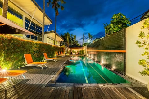 Property building, Patio, Night, Natural landscape, Pool view, Swimming pool, sunbed