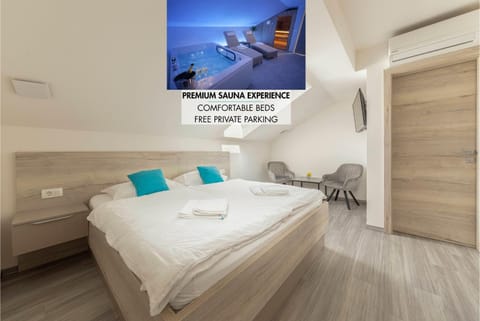 Bed, Photo of the whole room, Bedroom, Text overlay, towels