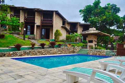 Property building, Garden, Pool view, Swimming pool, sunbed