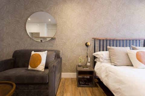 Bed, Living room, Seating area, Bedroom