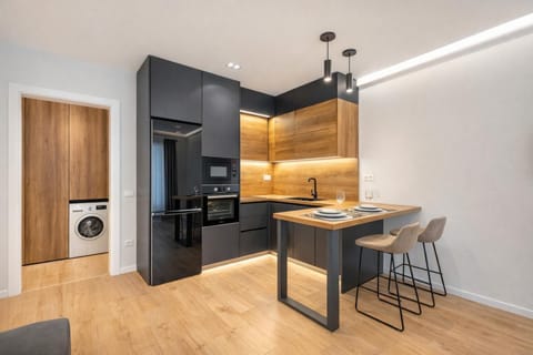 Dining area, microwave, stove, washing machine, kitchen