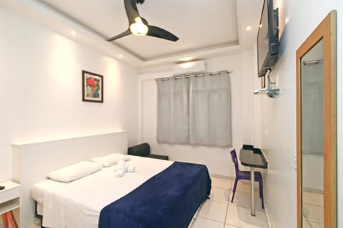 Bed, TV and multimedia, Bedroom, fireplace, hair dresser, air conditioner