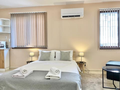 Bed, Photo of the whole room, Bedroom, towels, air conditioner