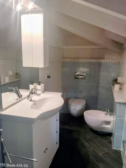 Toilet, Bathroom, bidet, hair dryier, towels